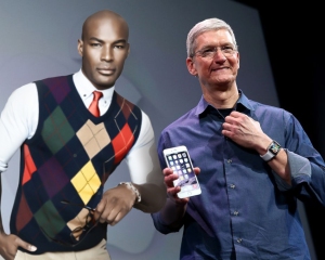 DREAM MAN: Tim Cook displaying Apple's latest offerings, the iMan, iPhone 6 and the Apple Watch